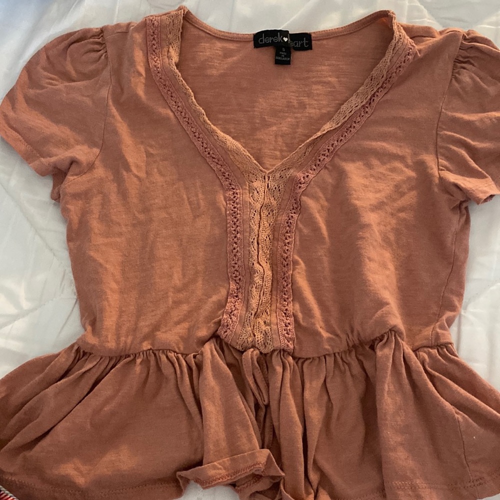Cute light pink/nude ruffle design shirt with a v neck